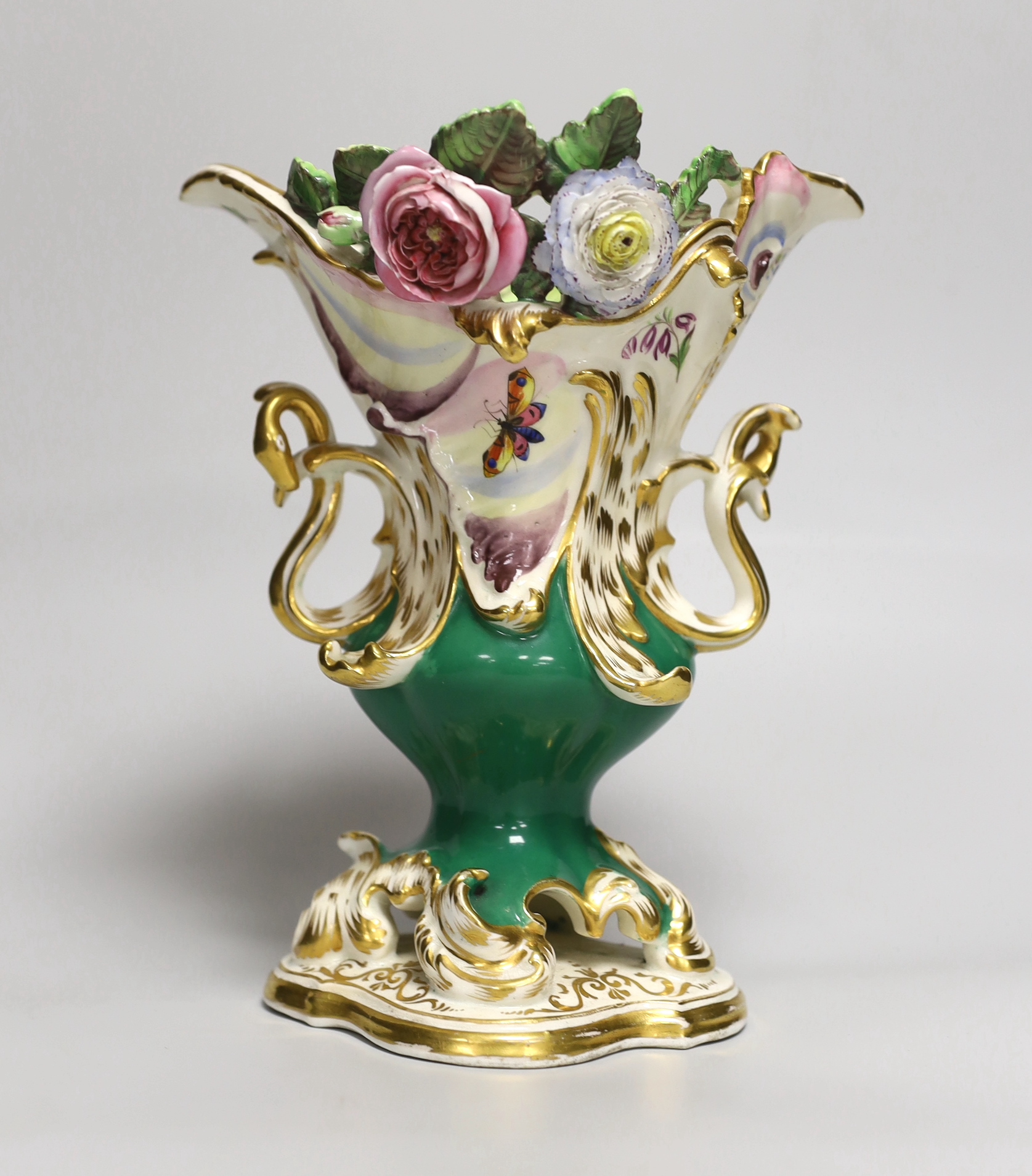 A 19th century Coalport two handled floral encrusted vase painted with flowers and a green ground, CD mark for Coalbrookdale, 21cm high